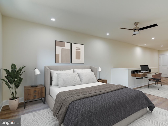 bedroom with ceiling fan and light hardwood / wood-style floors