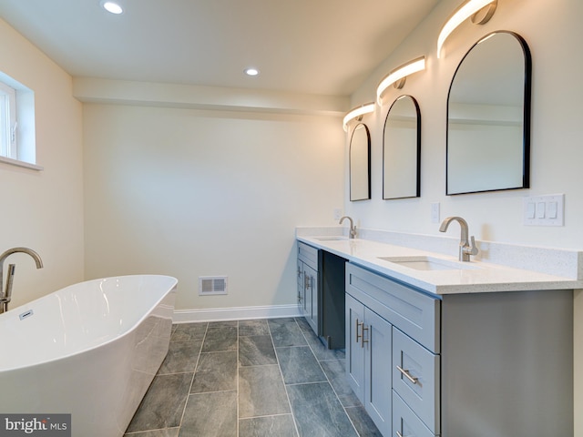 bathroom featuring vanity and a bathing tub