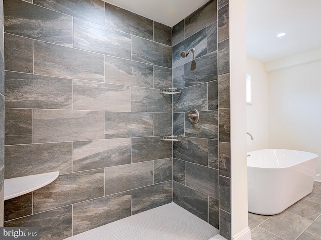 bathroom featuring separate shower and tub