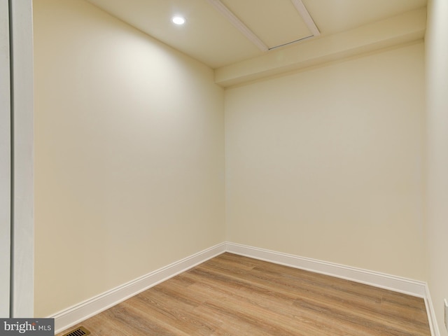 empty room with hardwood / wood-style floors