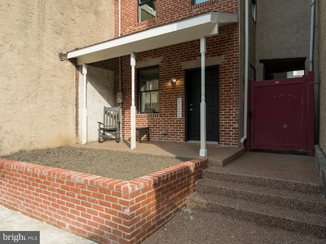 doorway to property with a porch