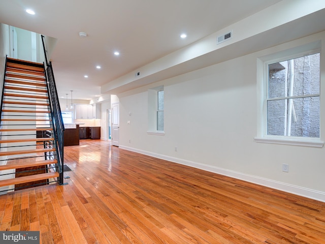 unfurnished living room with light wood-type flooring