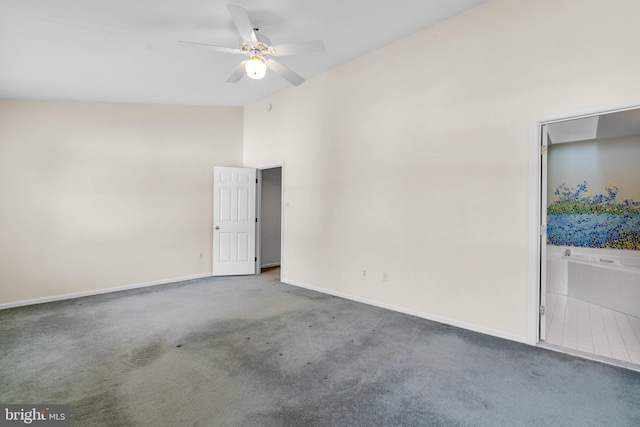 spare room featuring ceiling fan and carpet flooring