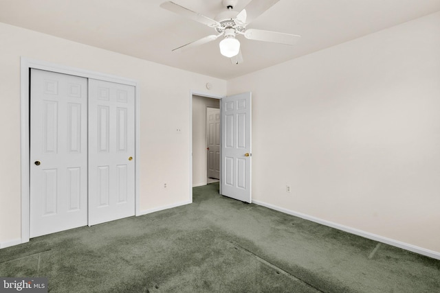 unfurnished bedroom with ceiling fan, a closet, and dark carpet