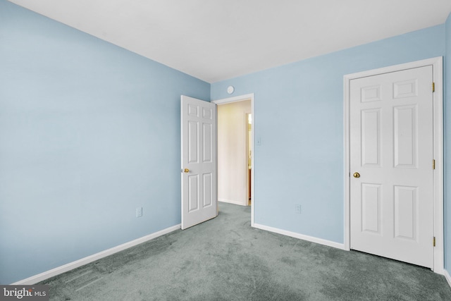 unfurnished bedroom featuring light colored carpet