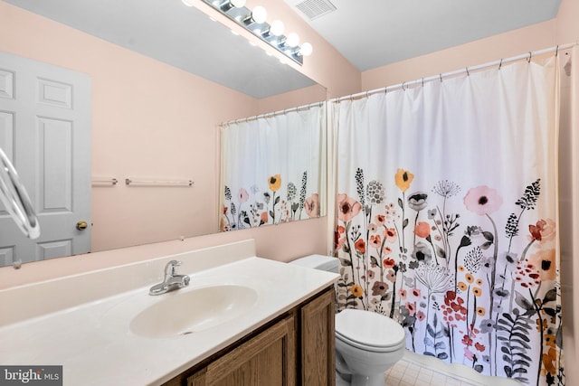 bathroom featuring toilet, a shower with curtain, and vanity