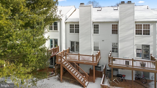 back of house with a wooden deck