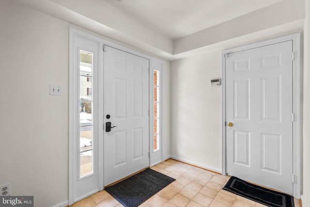 tiled entryway featuring plenty of natural light