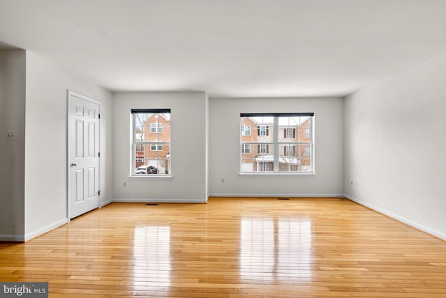 unfurnished room featuring light hardwood / wood-style floors