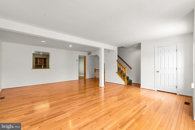 unfurnished living room with light hardwood / wood-style flooring