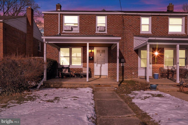 view of property featuring covered porch