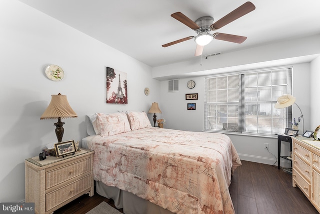 bedroom featuring ceiling fan and dark hardwood / wood-style floors