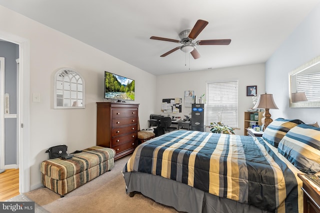 carpeted bedroom with ceiling fan