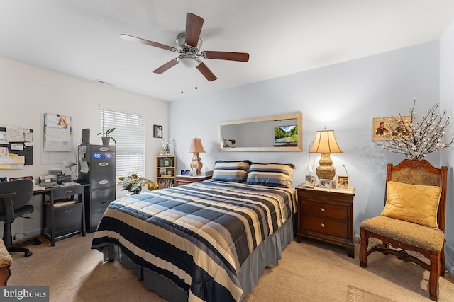 carpeted bedroom featuring ceiling fan