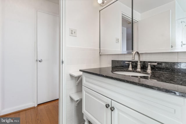 bathroom with hardwood / wood-style floors and vanity