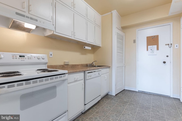 kitchen featuring white appliances, white cabinetry, and sink