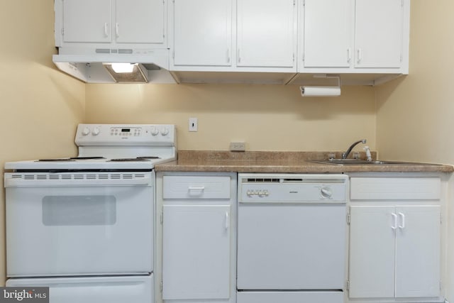 kitchen with white appliances, white cabinets, and sink