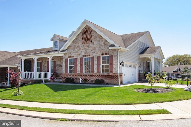 craftsman house with a porch, a garage, and a front yard