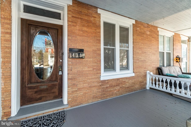 property entrance featuring covered porch