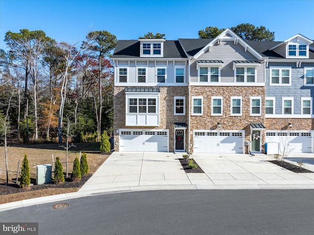 townhome / multi-family property featuring a garage