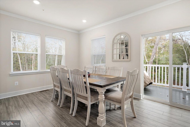 dining room featuring crown molding and wood-type flooring