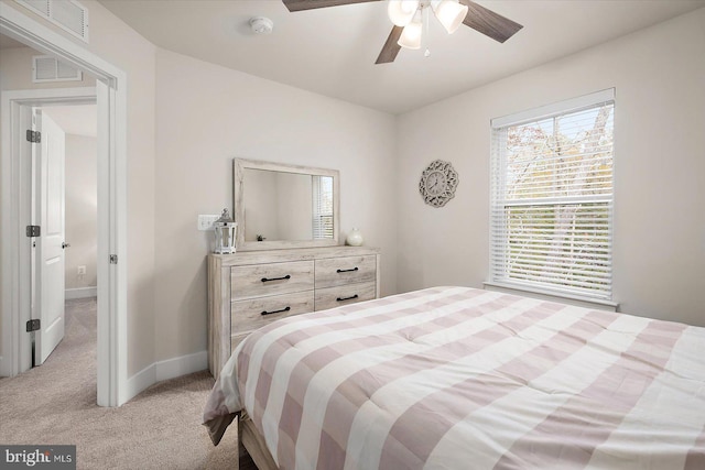 bedroom featuring ceiling fan and light carpet