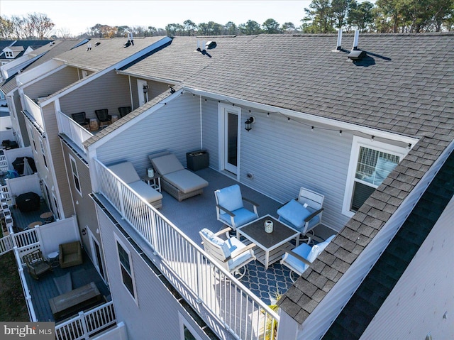 back of property featuring an outdoor living space