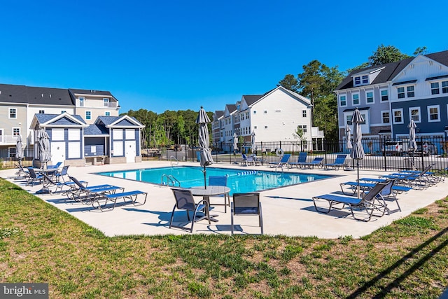 view of swimming pool with a patio area