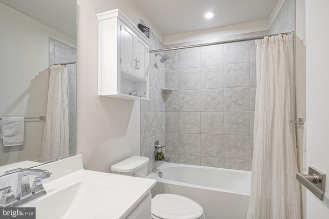 full bathroom featuring shower / tub combo with curtain, vanity, and toilet