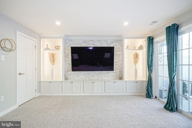 unfurnished living room with light carpet