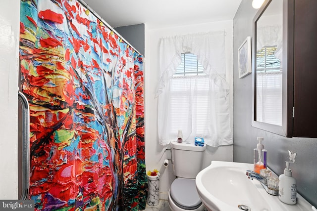 bathroom with sink and toilet