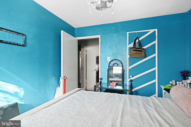 bedroom with a chandelier