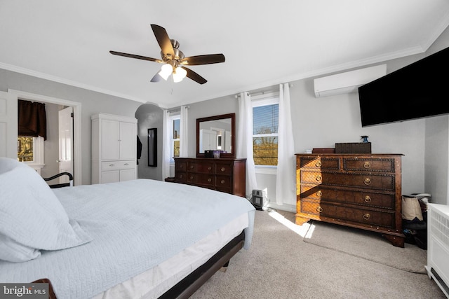 bedroom featuring ceiling fan, crown molding, light carpet, and a wall unit AC