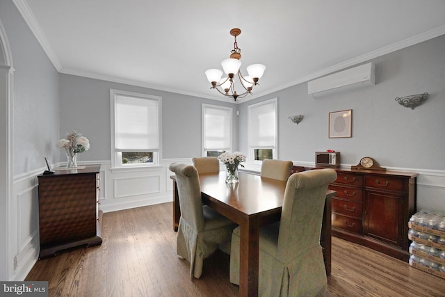 dining room featuring a wall mounted air conditioner, a wealth of natural light, and crown molding