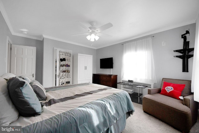 bedroom with ceiling fan, light carpet, and ornamental molding