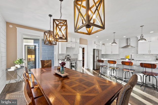 dining room featuring beverage cooler and dark hardwood / wood-style floors