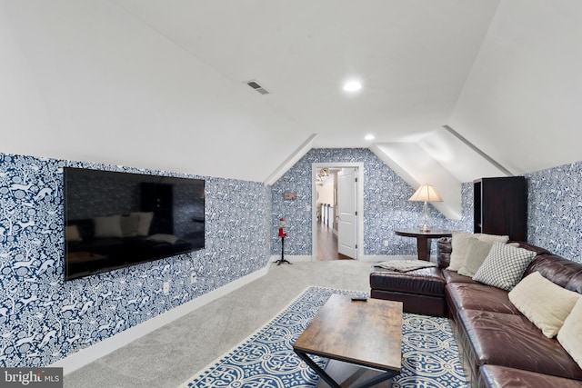 living room with vaulted ceiling and carpet