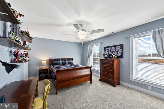 carpeted bedroom featuring ceiling fan