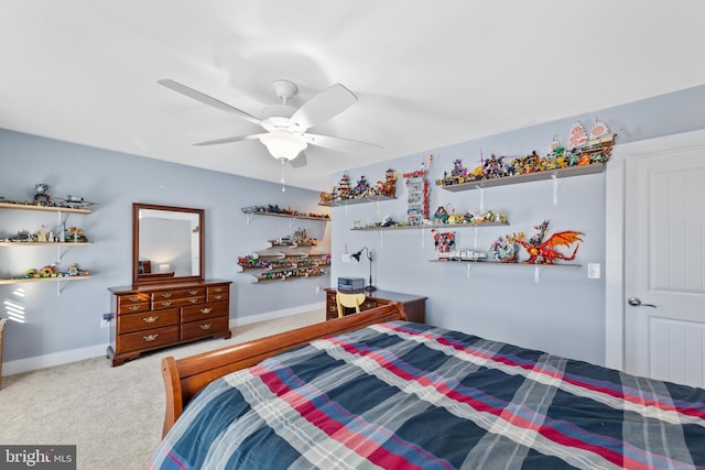 bedroom featuring ceiling fan and carpet