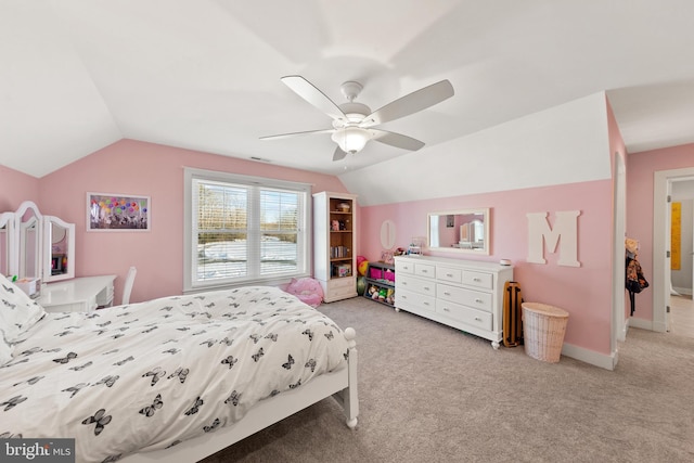 carpeted bedroom with lofted ceiling and ceiling fan