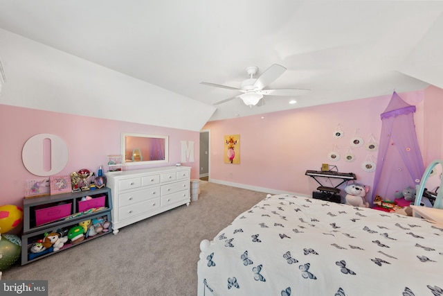 bedroom with ceiling fan, vaulted ceiling, and light colored carpet