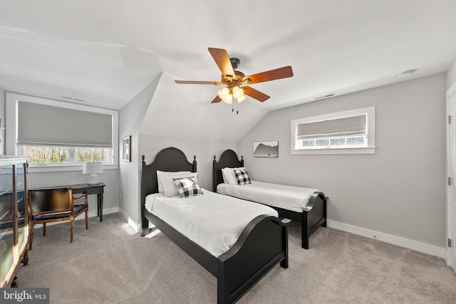 bedroom with light carpet, ceiling fan, and vaulted ceiling