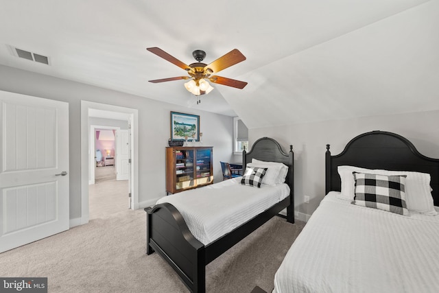 carpeted bedroom featuring ceiling fan and lofted ceiling