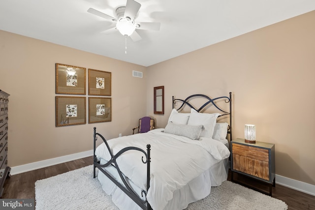 bedroom with dark wood-type flooring and ceiling fan