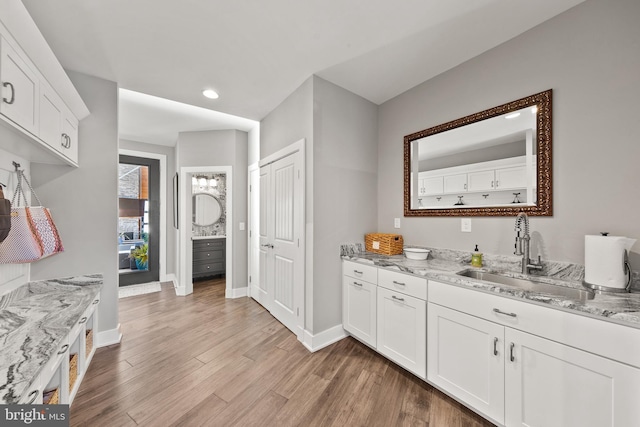 bathroom featuring vanity and wood-type flooring