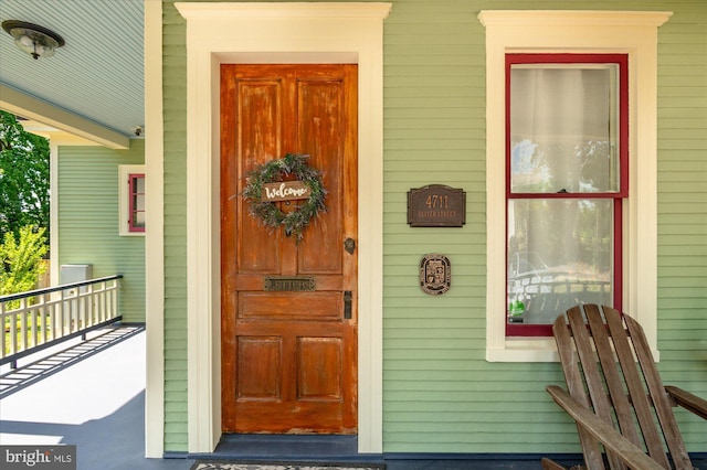 property entrance with covered porch