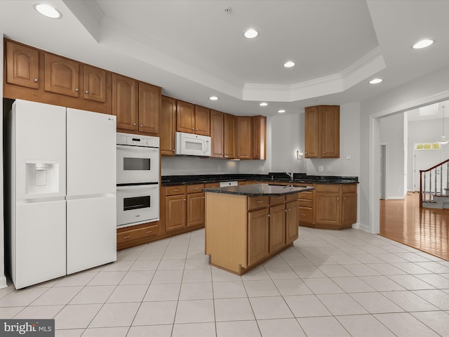 kitchen with crown molding, white appliances, recessed lighting, and a tray ceiling