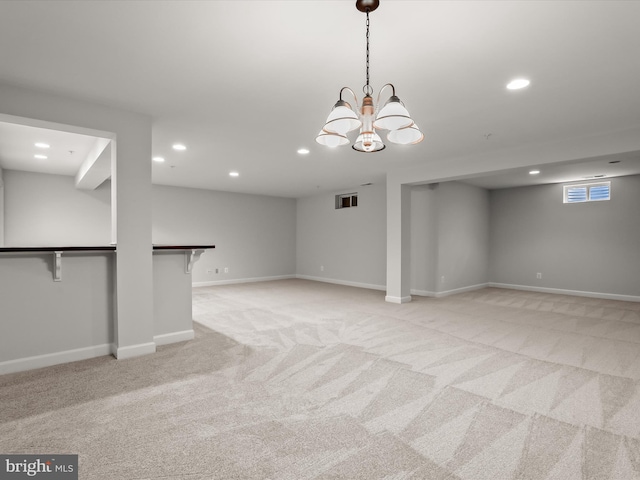 basement featuring recessed lighting, baseboards, and light carpet