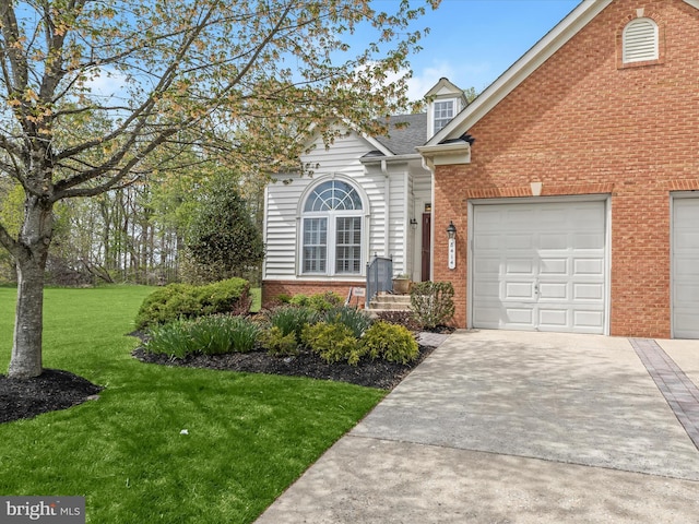 traditional-style home with concrete driveway, a front lawn, and brick siding
