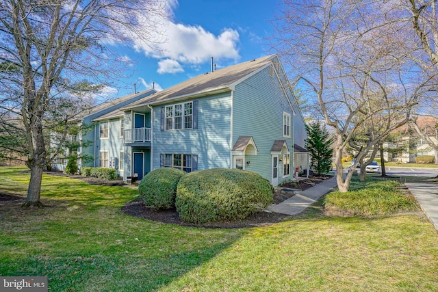 view of property exterior with a yard